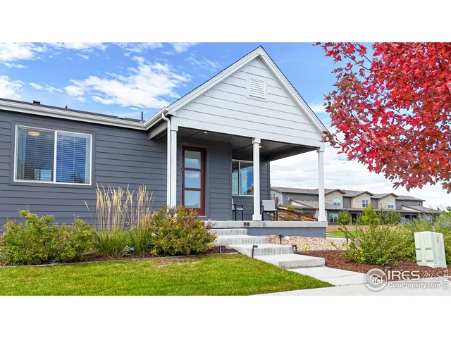 a view of a house with backyard porch and sitting area