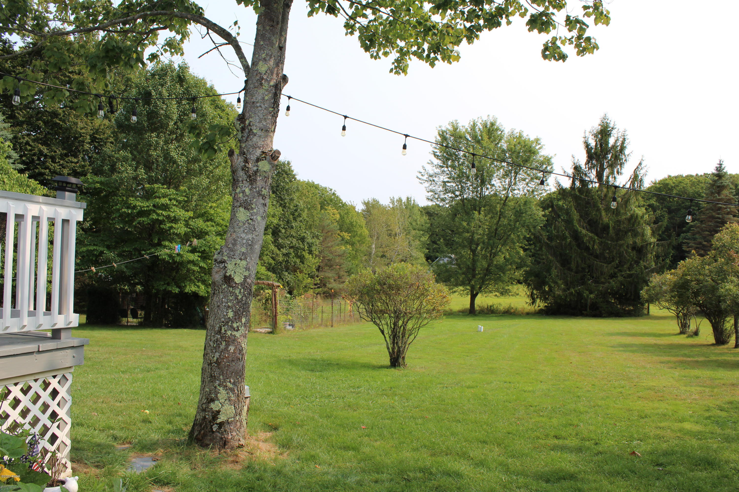 798 Goose Pond Road Lake Ariel, PA 18436 - Photo 5 of 47 a view of green field with trees in the background