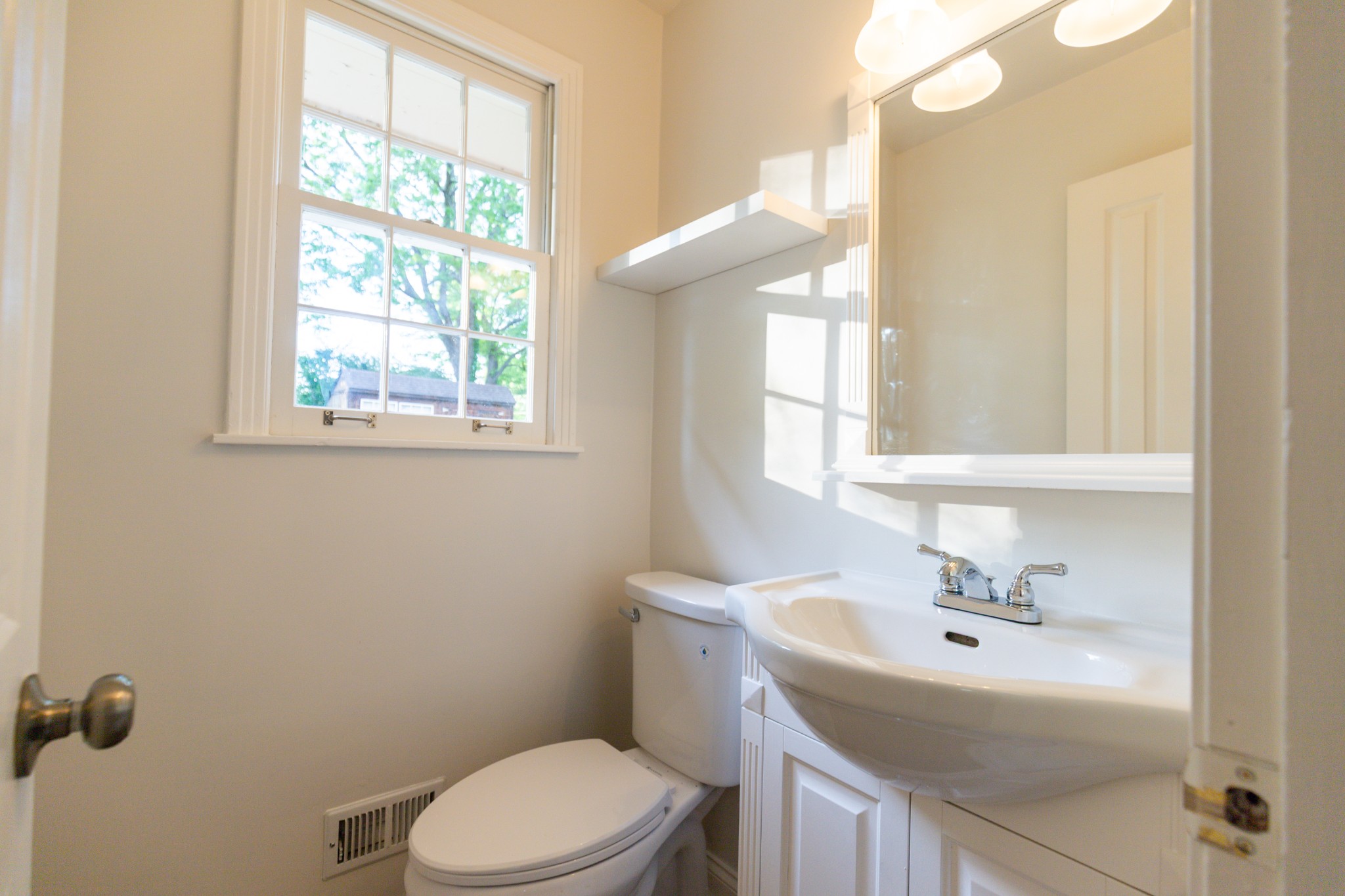 1240 Sioux Terrace Madison, TN 37115 - Photo 16 of 27 a bathroom with a sink a toilet and a window