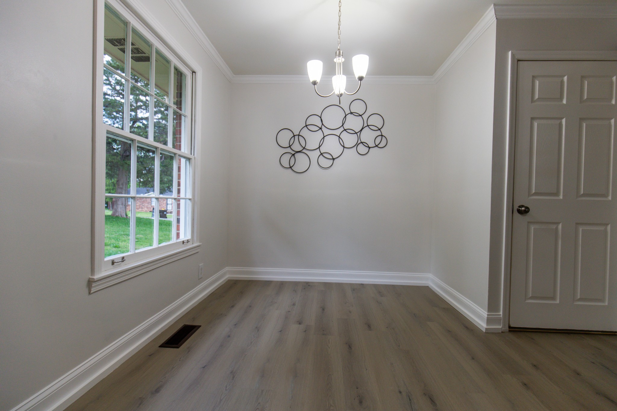 1240 Sioux Terrace Madison, TN 37115 - Photo 5 of 27 wooden floor in an empty room with a window