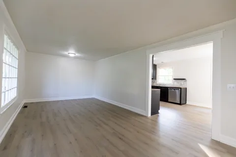 a view of a kitchen with a sink and a microwave