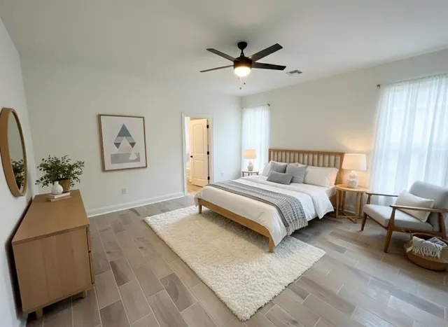 a bathroom with a granite countertop sink and a bathtub