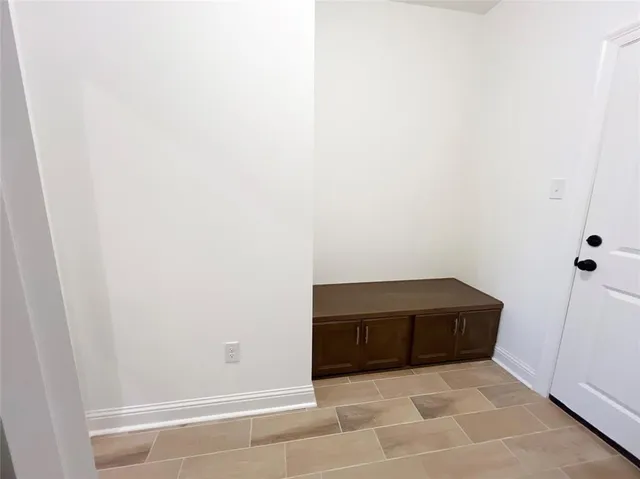 a kitchen with a stove and a microwave