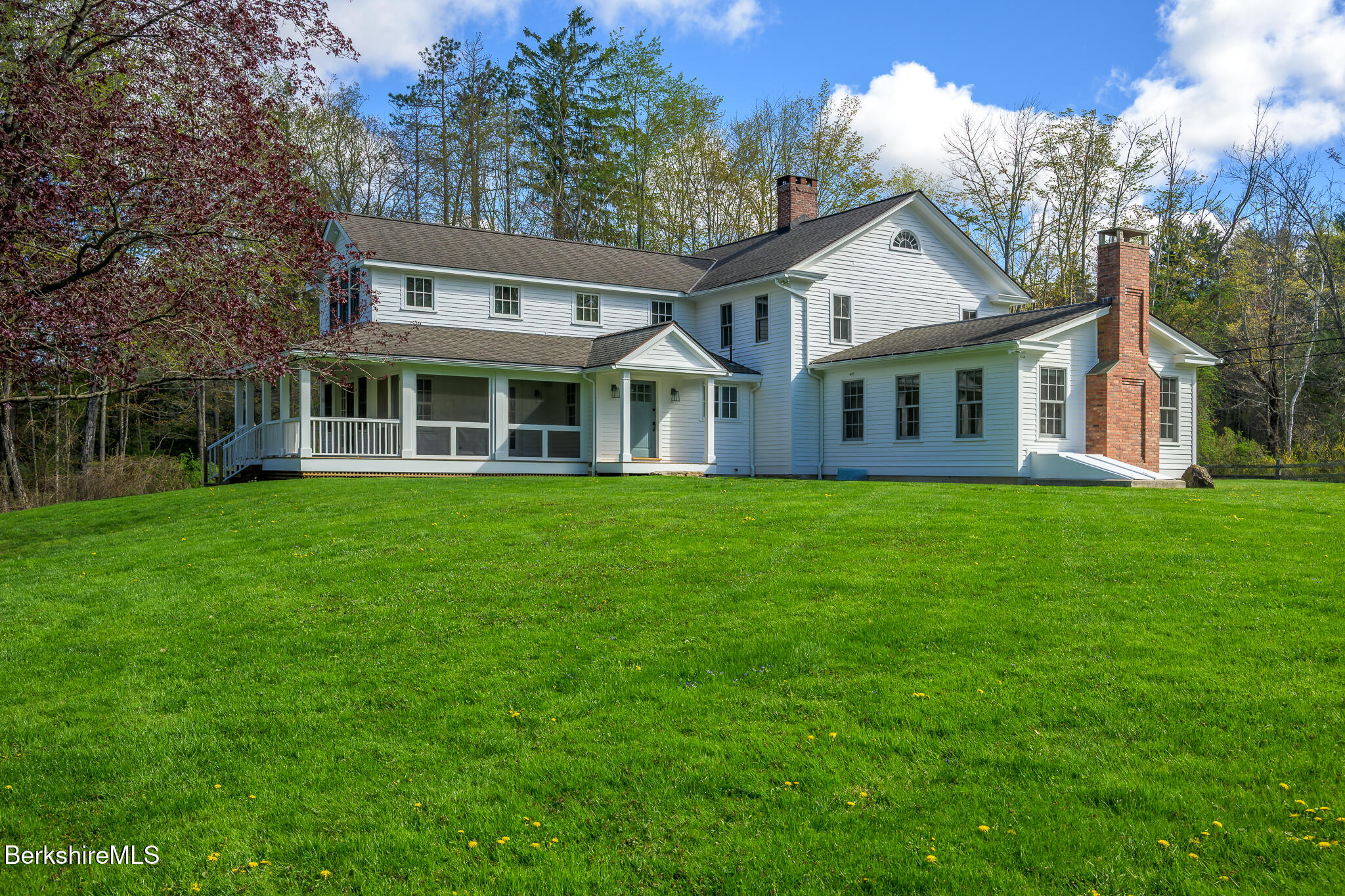 304 Hickey Hill Road Sheffield, MA 01257 - Photo 2 of 60 a front view of a house with a garden and trees