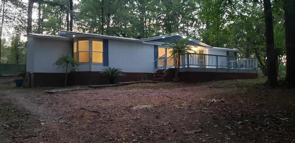 125 Sputnik Street Fortson, GA 31808 - Photo 28 of 30 a backyard of a house with lots of green space
