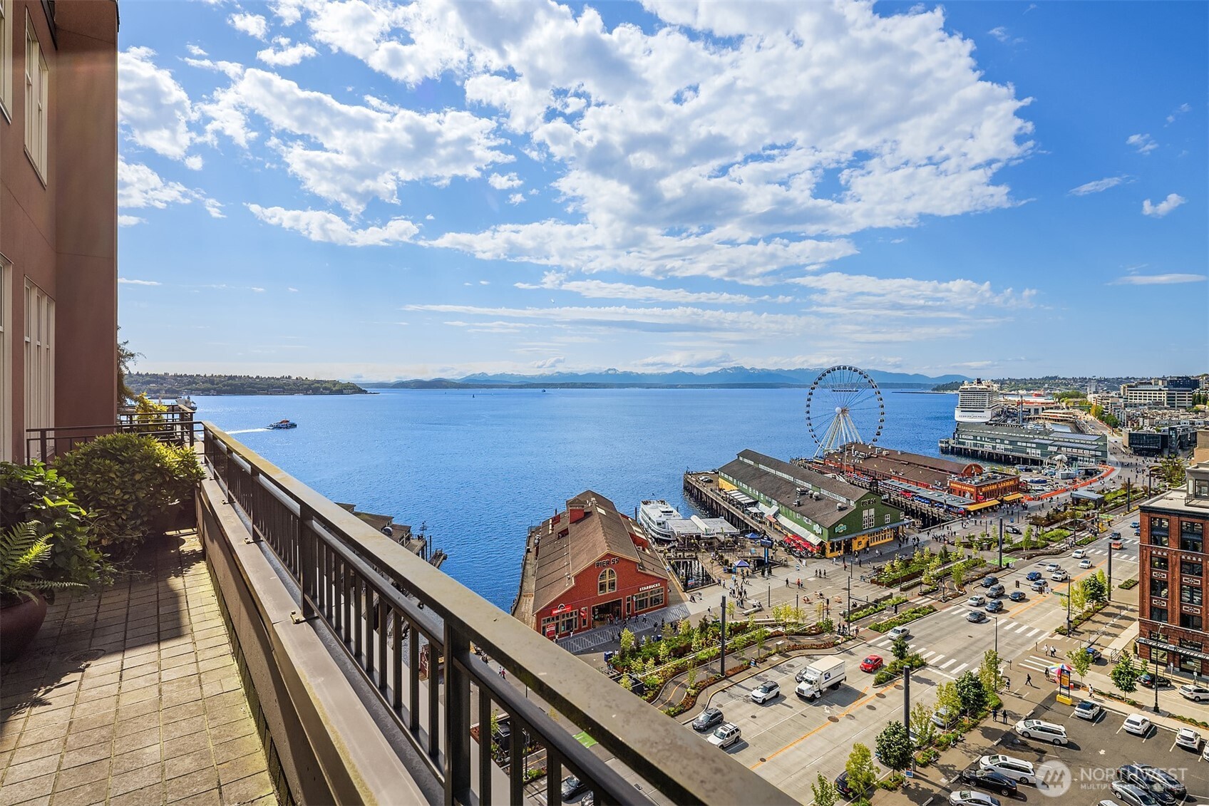 1009 Western Avenue, Unit 1203 Seattle, WA 98104 - Photo 16 of 22 a view of a balcony with wooden floor and city view
