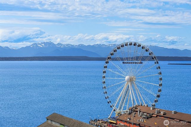 a view of a room with an empty space and a mountain view