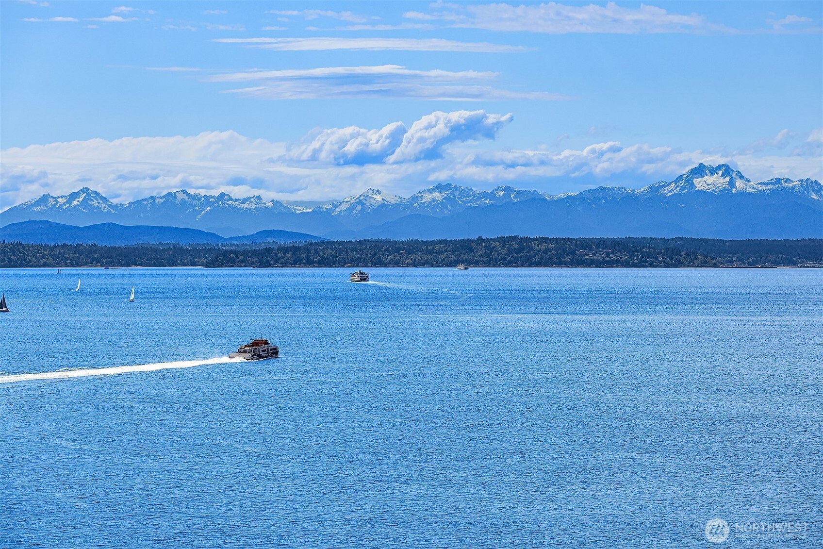 1009 Western Avenue, Unit 1203 Seattle, WA 98104 - Photo 21 of 30 a view of an ocean with a mountain