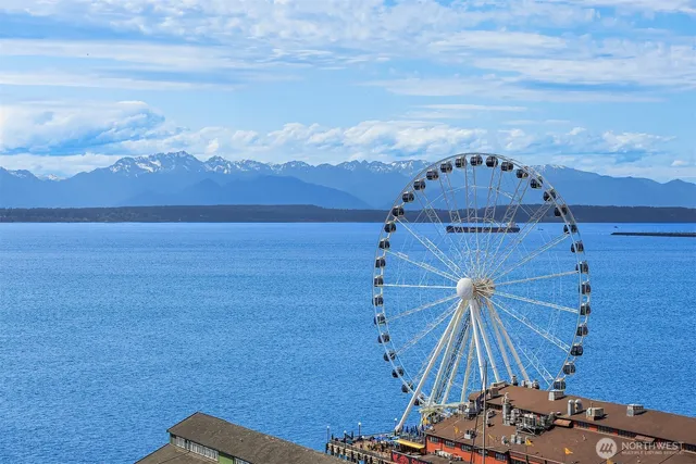 a view of a chairs and table in the balcony