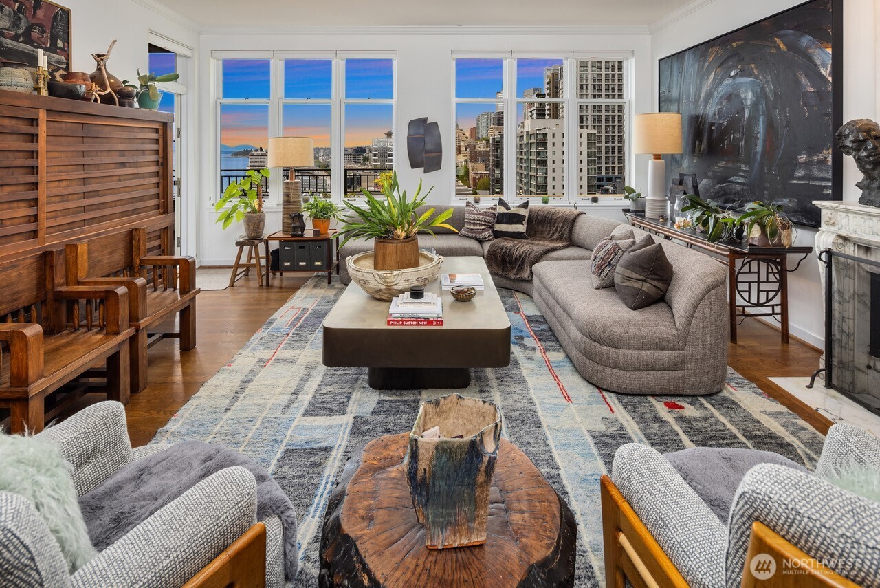 1009 Western Avenue, Unit 1203 Seattle, WA 98104 - Photo 3 of 22 a living room with furniture fireplace and a large window