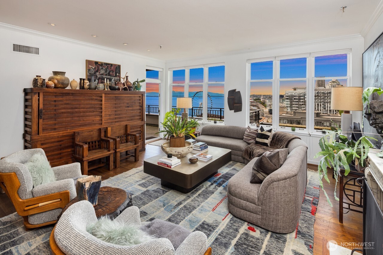 1009 Western Avenue, Unit 1203 Seattle, WA 98104 - Photo 4 of 22 a living room with furniture fireplace and a flat screen tv