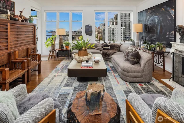 a living room with furniture and a fireplace