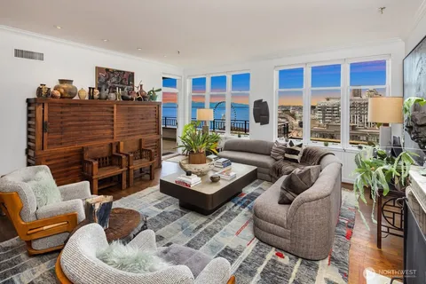 a living room with furniture fireplace and a flat screen tv