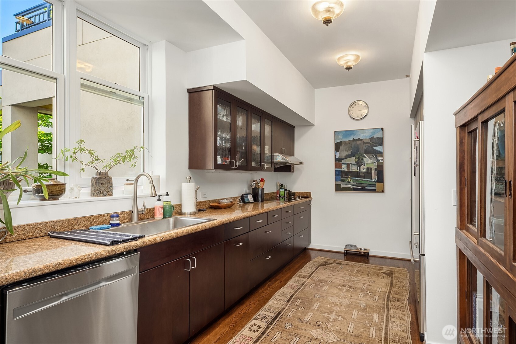 1009 Western Avenue, Unit 1203 Seattle, WA 98104 - Photo 10 of 30 a spacious bathroom with a granite countertop sink a mirror and a shower