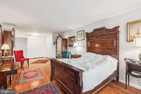 a bedroom with a bed and chair