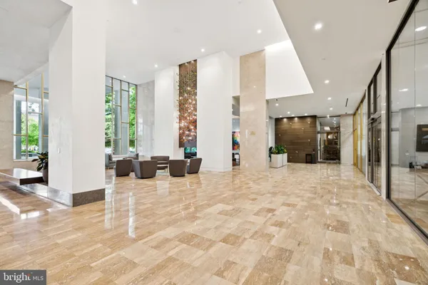 a view of an entryway with livingroom and windows