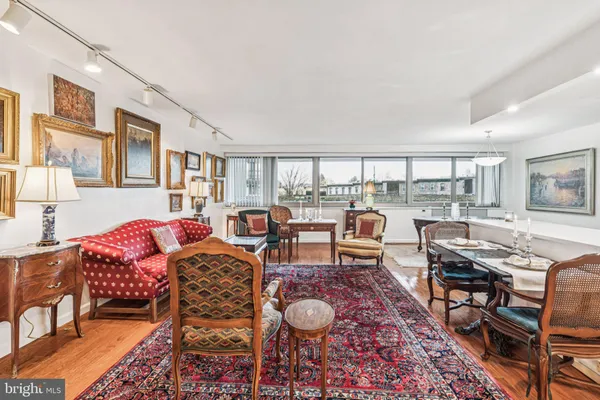 a living room with furniture and a rug