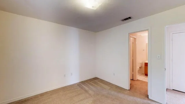 an empty room with a bathroom