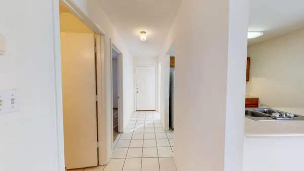 a view of bathroom with a tub shower and a sink