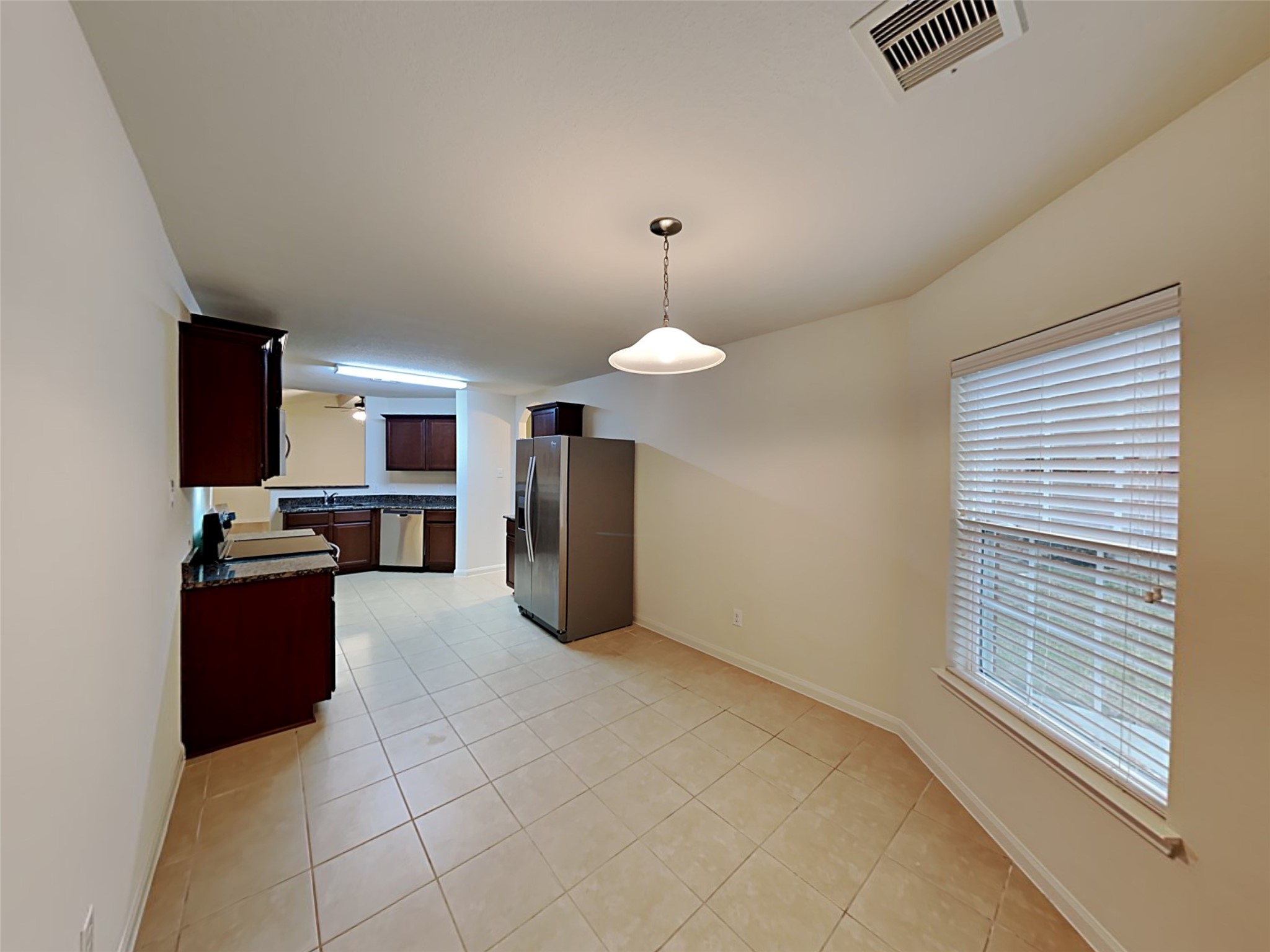 22718 Klingamans Way Hockley, TX 77447 - Photo 4 of 20 a view of kitchen and dining room with furniture
