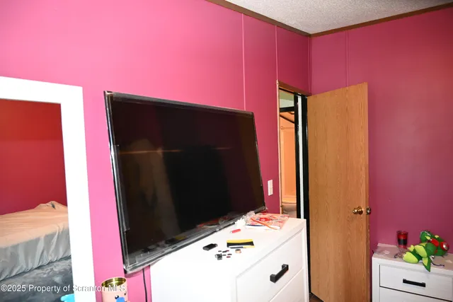 a bathroom with a sink a mirror and a shower