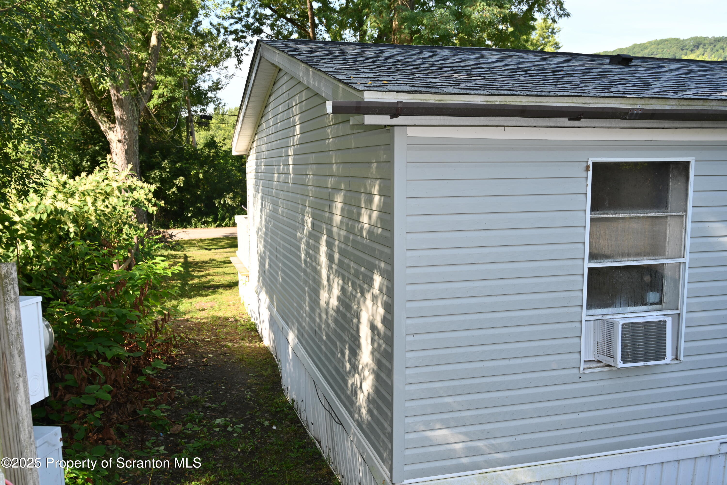 84 Spring Street Great Bend, PA 18821 - Photo 19 of 20 a front view of a house with a yard
