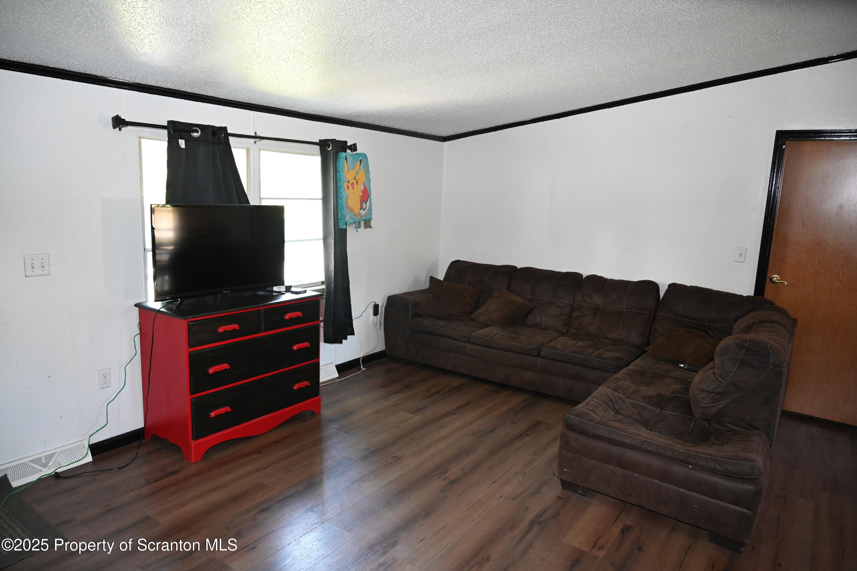84 Spring Street Great Bend, PA 18821 - Photo 5 of 20 a living room with furniture and a flat screen tv