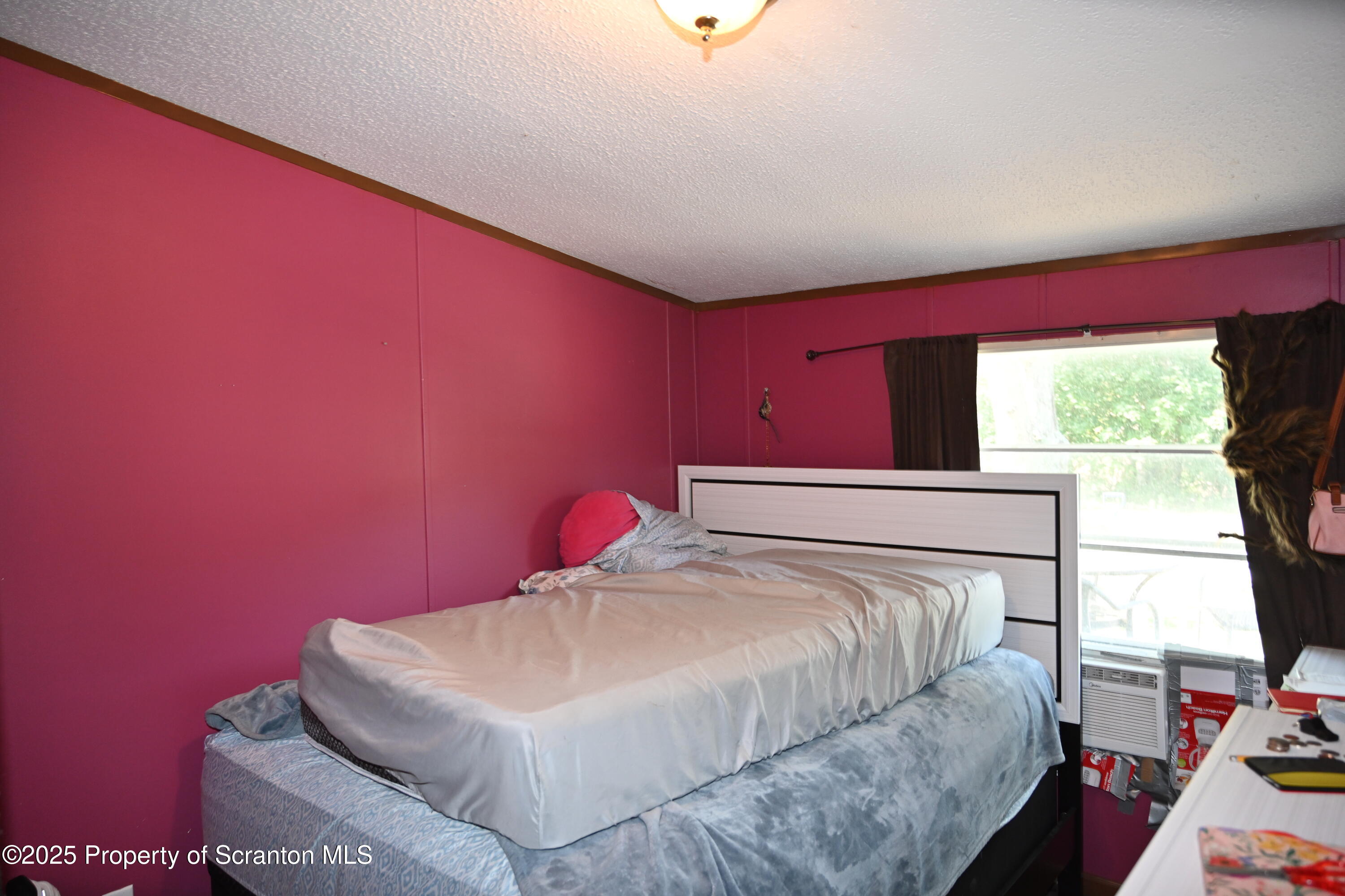 84 Spring Street Great Bend, PA 18821 - Photo 10 of 20 a bedroom with a bed and a window