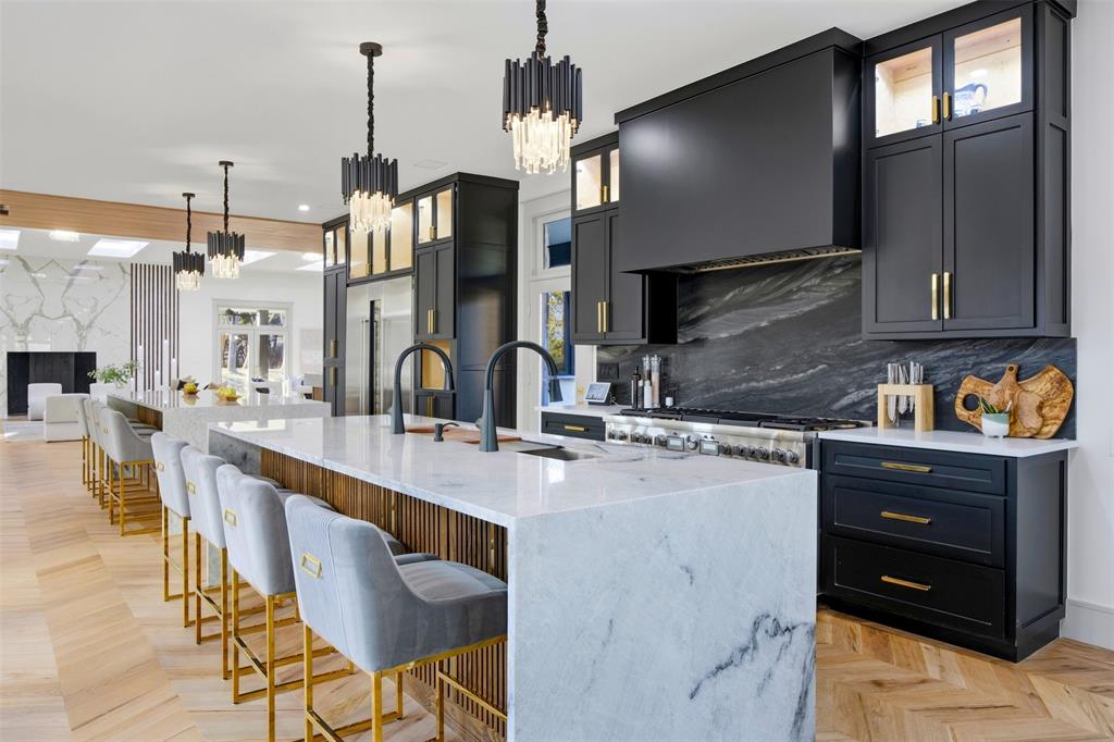 1000 West Wintergreen Road DeSoto, TX 75115 - Photo 21 of 40 a kitchen with stainless steel appliances a sink stove and cabinets