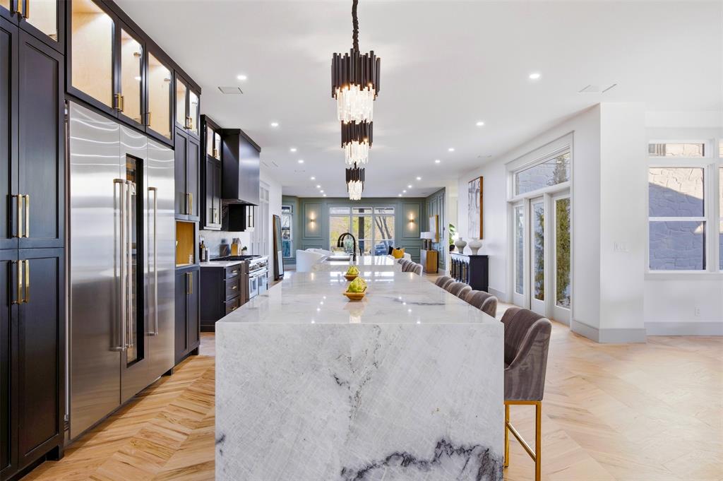 1000 West Wintergreen Road DeSoto, TX 75115 - Photo 22 of 40 a view of kitchen with stainless steel appliances refrigerator stove dining table and chairs