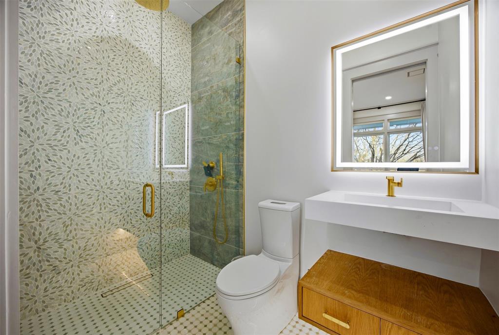 1000 West Wintergreen Road DeSoto, TX 75115 - Photo 32 of 40 a bathroom with a sink toilet and shower