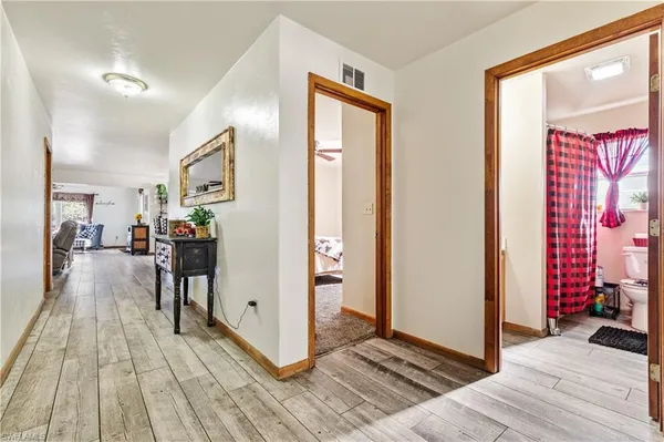 a view of a livingroom with wooden floor and closet
