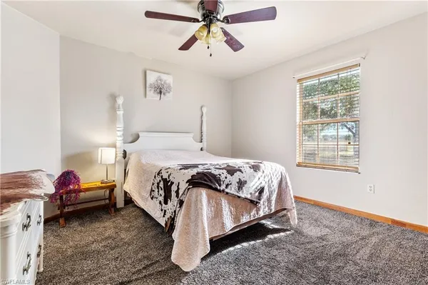 a view of livingroom with furniture and ceiling fan