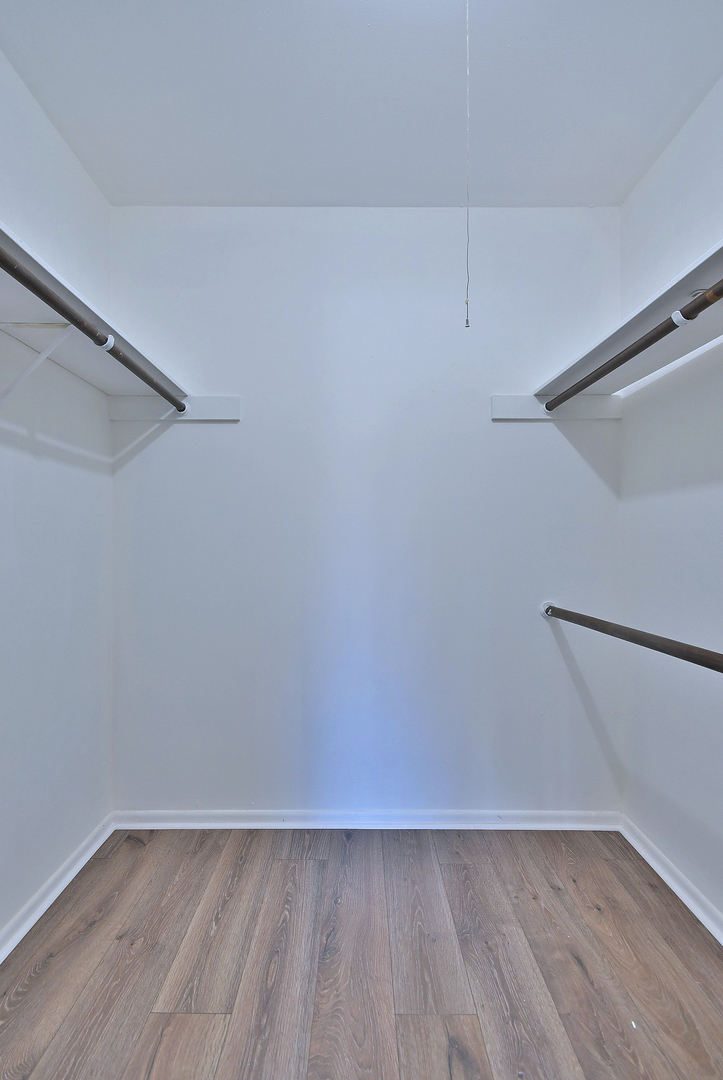 6177 Knoll Wood Road, Unit 102 Willowbrook, IL 60527 - Photo 12 of 19 a view of an empty room with wooden floor