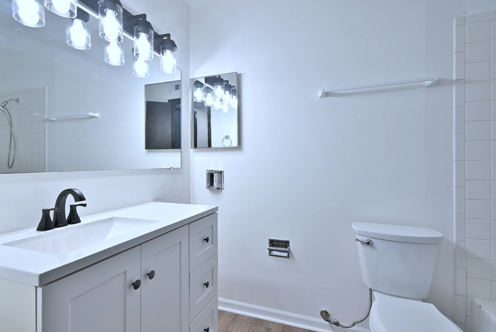 6177 Knoll Wood Road, Unit 102 Willowbrook, IL 60527 - Photo 13 of 19 a bathroom with a sink a toilet and mirror