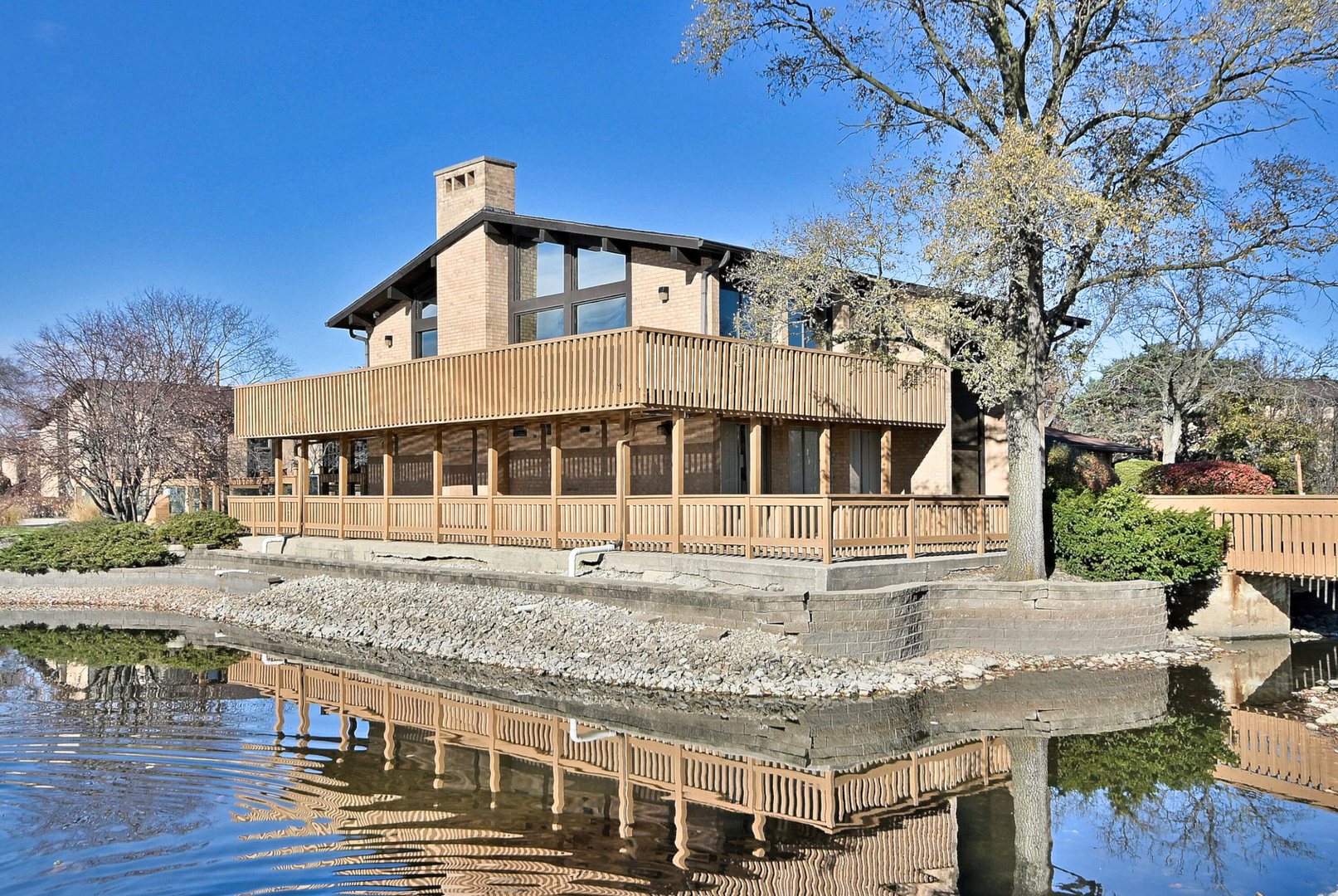 6177 Knoll Wood Road, Unit 102 Willowbrook, IL 60527 - Photo 17 of 19 a front view of a house with a yard