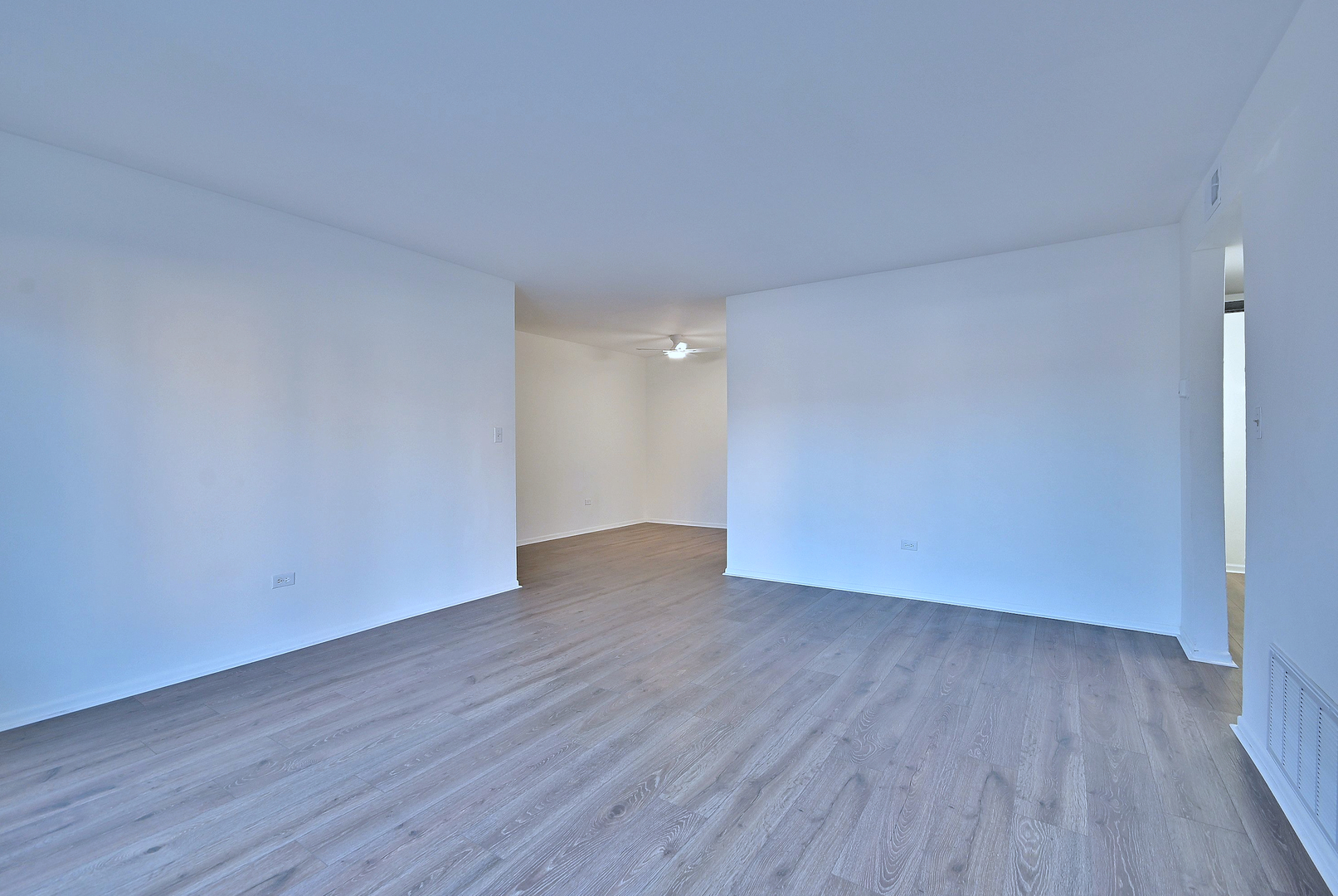 6177 Knoll Wood Road, Unit 102 Willowbrook, IL 60527 - Photo 9 of 19 a view of an empty room with wooden floor and closet