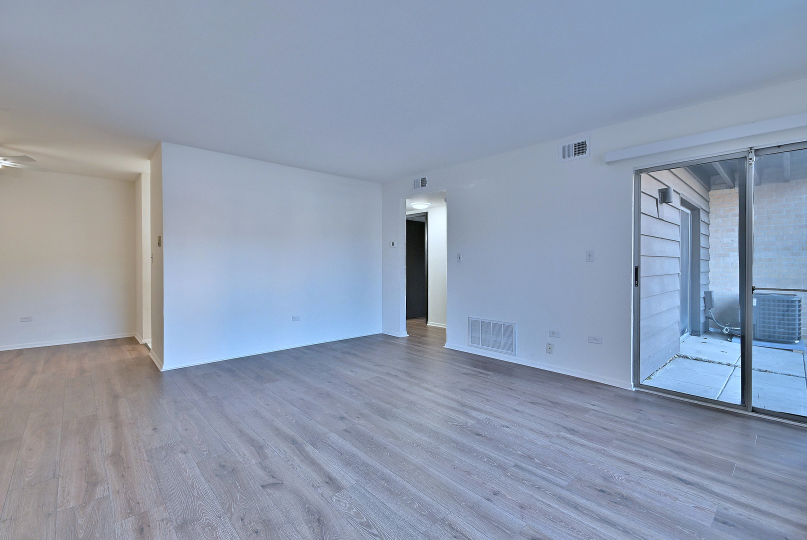 6177 Knoll Wood Road, Unit 102 Willowbrook, IL 60527 - Photo 10 of 19 a view of an empty room with wooden floor