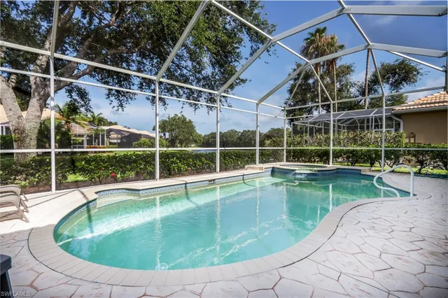a view of a swimming pool with a patio