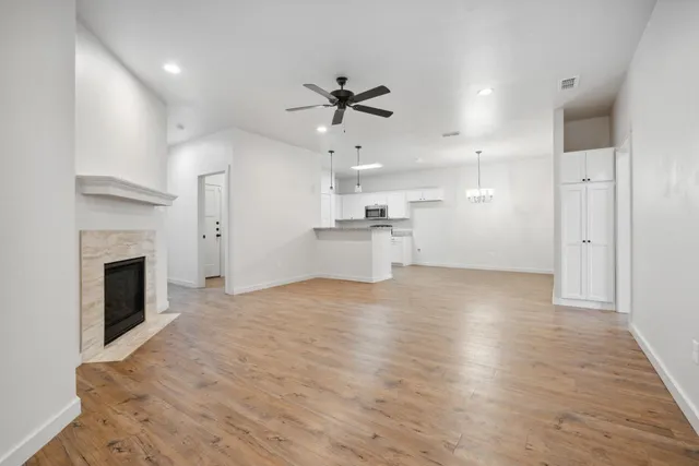 a view of a kitchen with a stove cabinets and wooden floor