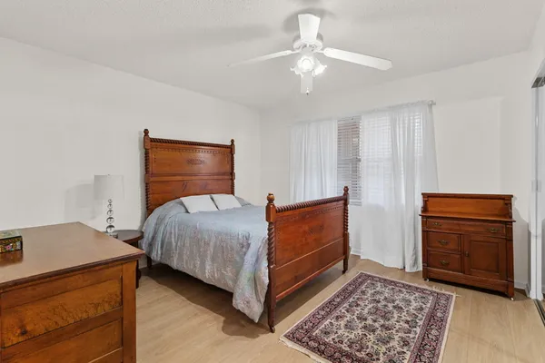 a bedroom with a bed and a dresser