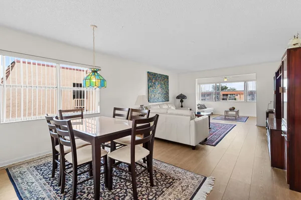 a view of a dining room with furniture and a table