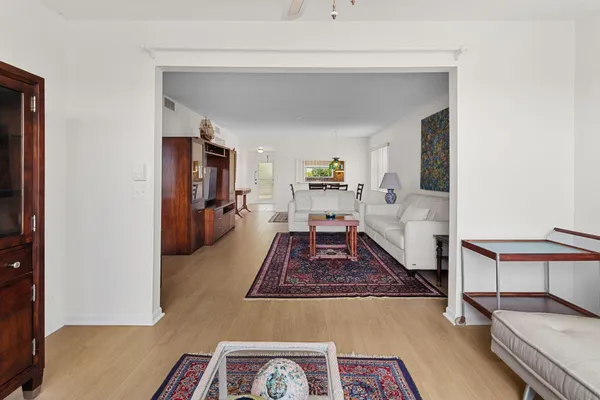 a living room with furniture and a rug
