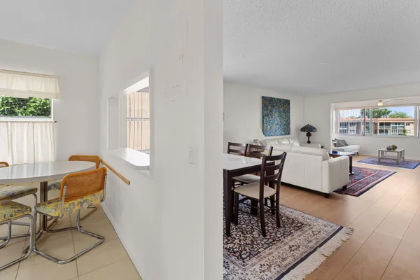 a living room with furniture a table and a window