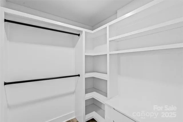 a bathroom with a sink a mirror a toilet and a bathtub