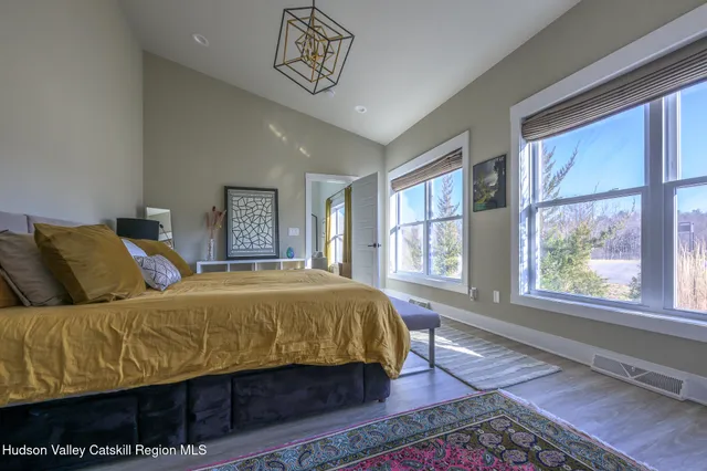 a bedroom with a large bed and a window
