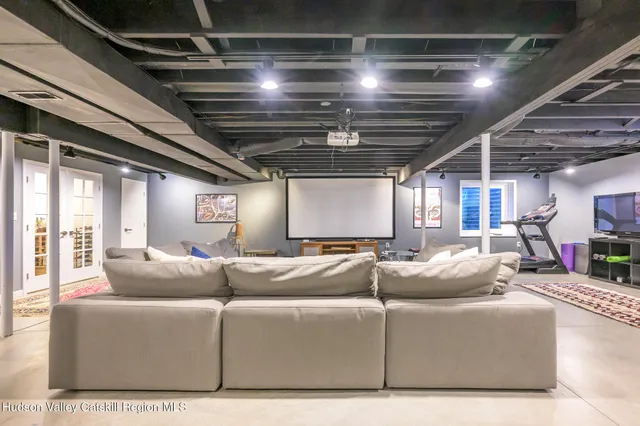 a living room with furniture a chandelier