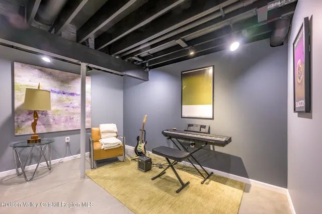 a work room with furniture and a window