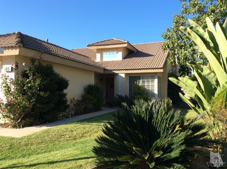 65 Valley Crest Road, Unit 74 Simi Valley, CA 93065 - Photo 1 of 25 a front view of a house with a yard