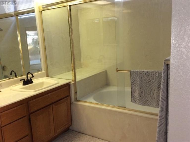 65 Valley Crest Road, Unit 74 Simi Valley, CA 93065 - Photo 16 of 25 a bathroom with a shower and a glass door